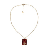 Amchoor Cognac colored hand sewn leather pouch and silver Cross Necklace