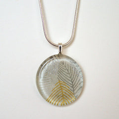 Gold and Silver Round Glass Pendant